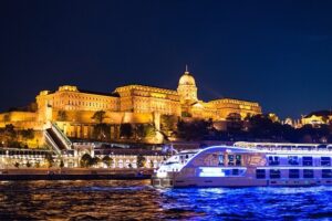Buda castle and a boat on the Danube river