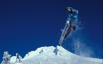 Snowboarer making tricks in French mountain ski resorts