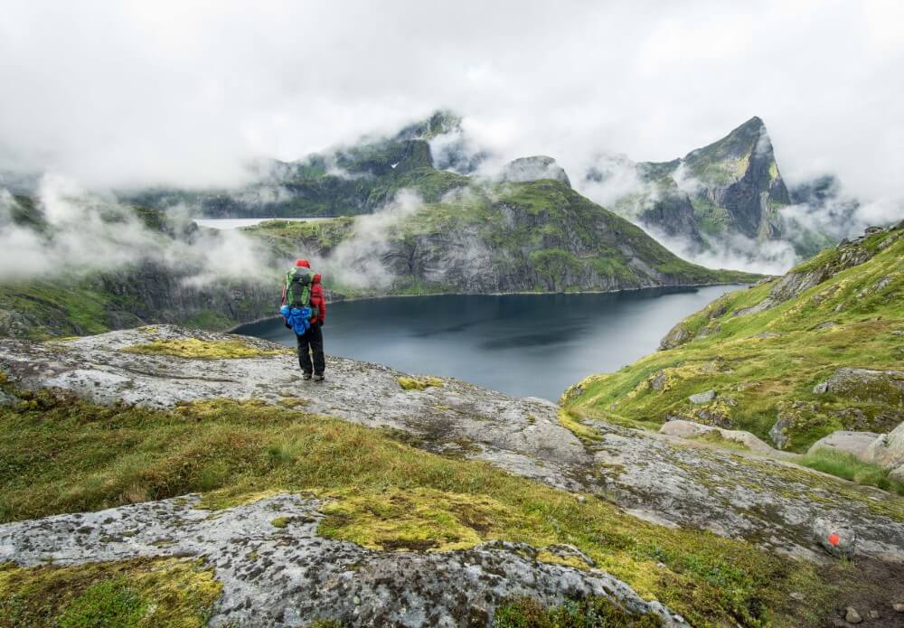 Norway hiking in the mountains with full backpack of items