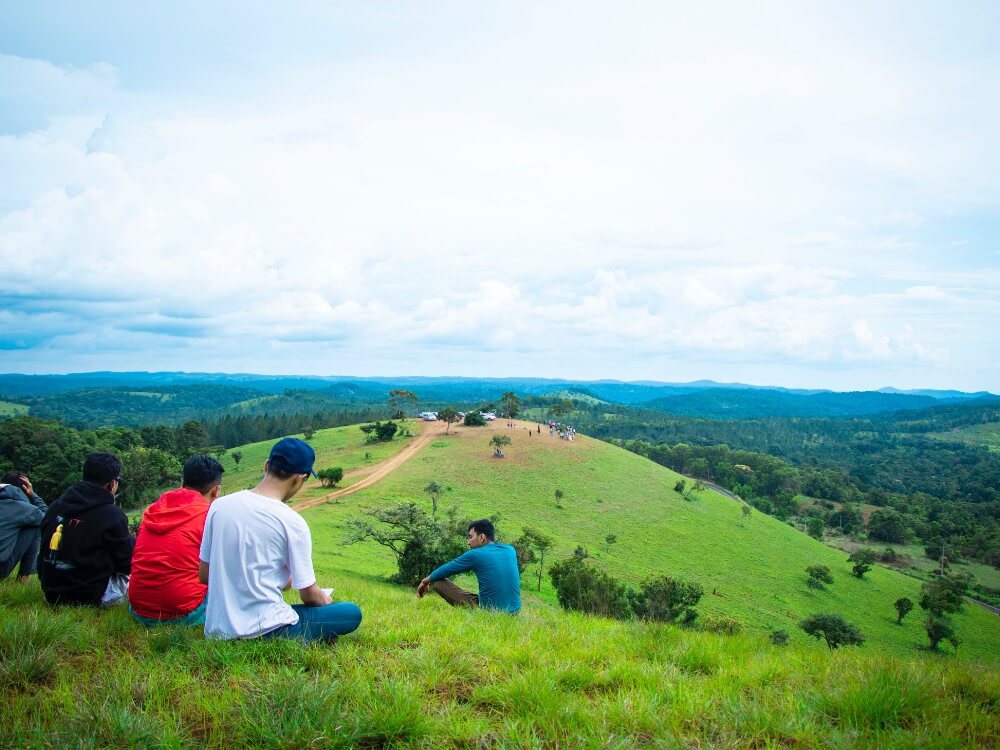 Mondulkiri hills in Cambodia with people sitting