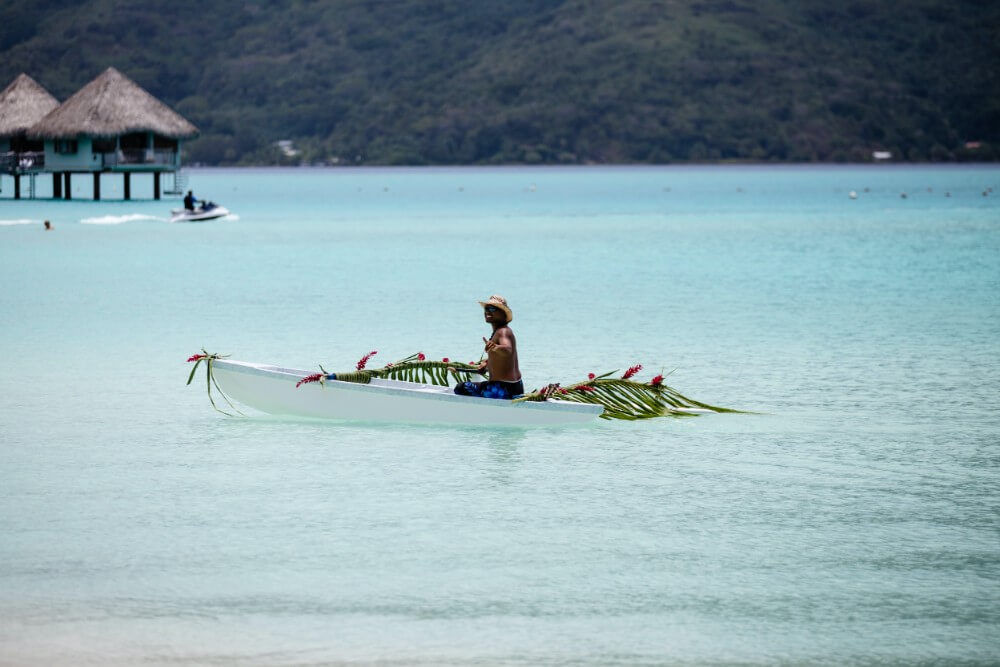 Bora Bora Indonesia island local man on a boat