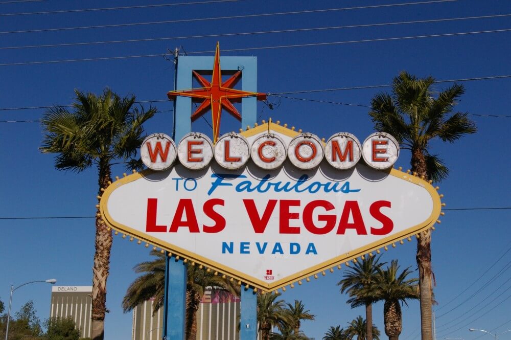 Las Vegas welcome sign with palm trees