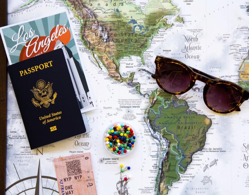 Travel map and documents, glasses, trip planning and budgeting