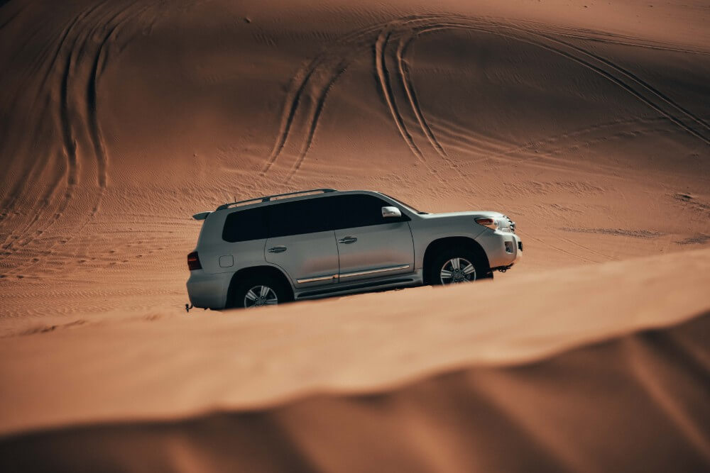Car in a desert safari, things to do in Abu Dhabi